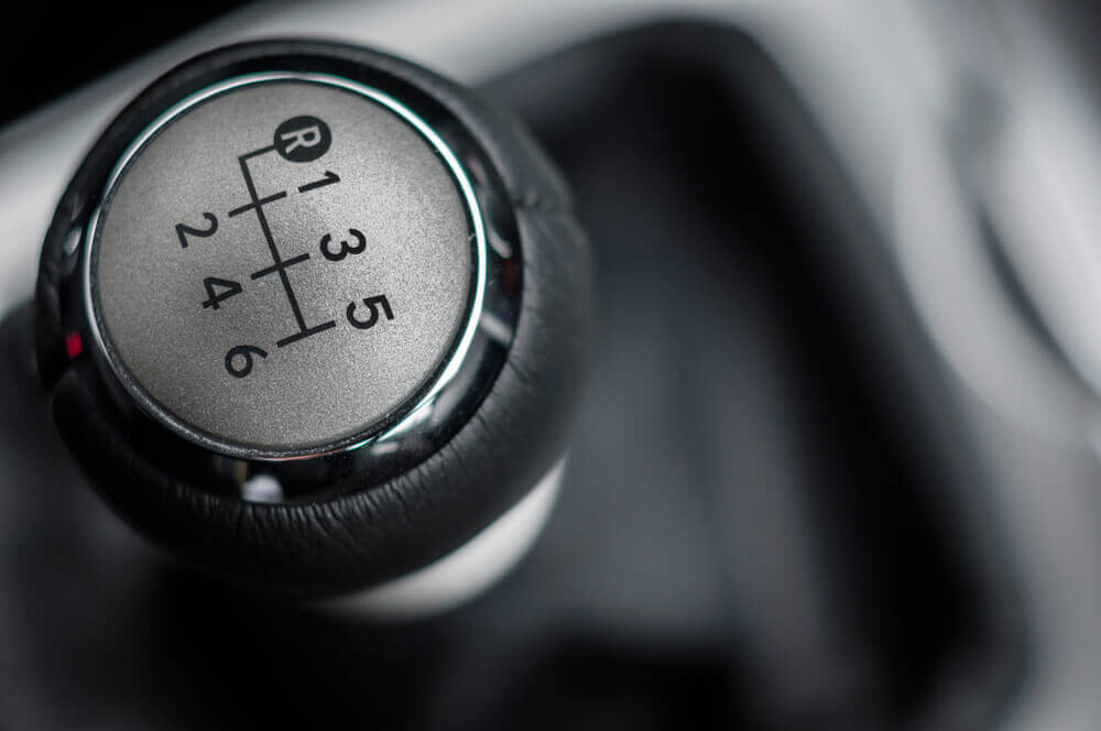 close image of driving school Mandurah's manual car gear knob with the numbers showing